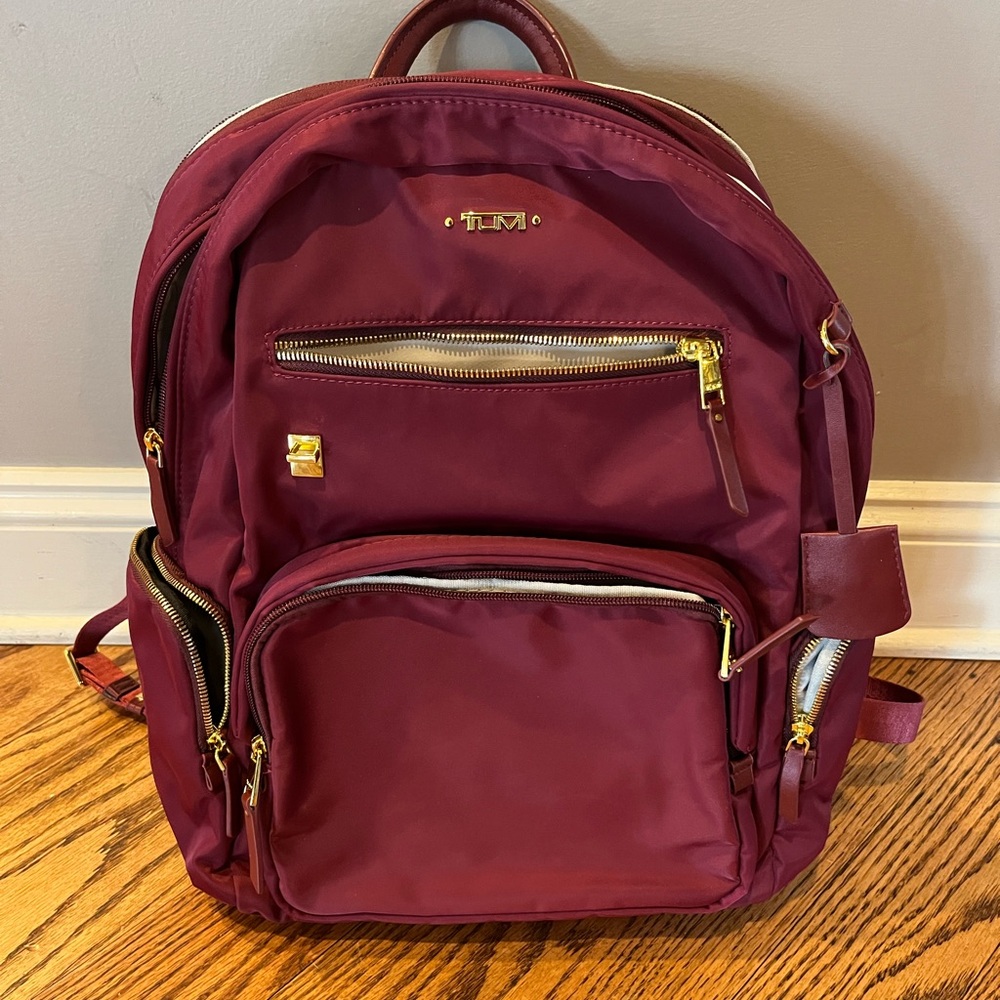 TUMI Maroon Backpack with Gold Accents